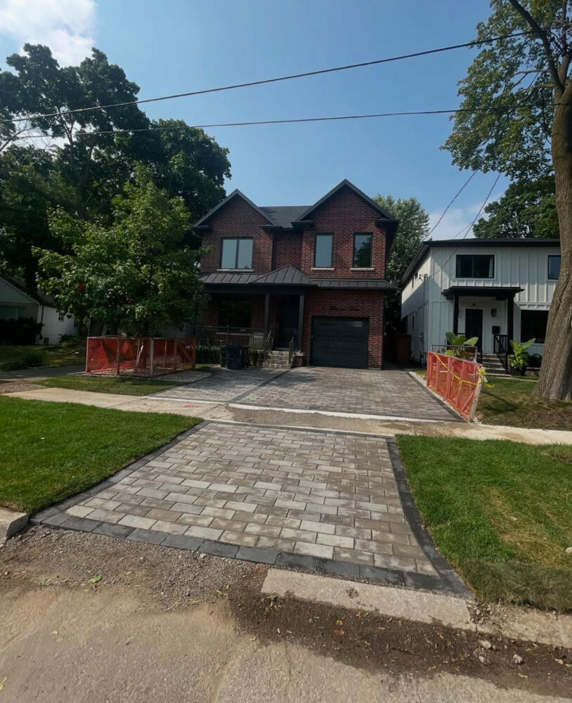 Street view of interlock driveway and front yard by APM Construction.